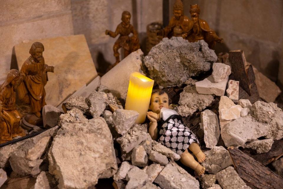 The Nativity scene shows baby Jesus wrapped in a keffiyeh and placed in a rubble to show solidarity with the people of Gaza