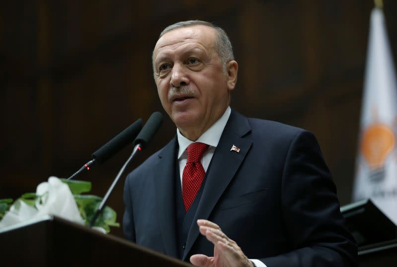 Turkish President Erdogan addresses lawmakers from his ruling AK Party during a meeting at the parliament in Ankara