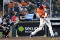 Houston Astros' Myles Straw connects for a RBI single in front of Detroit Tigers catcher Wilson Ramos during the second inning of a baseball game Tuesday, April 13, 2021, in Houston. (AP Photo/Michael Wyke)