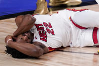Miami Heat forward Jimmy Butler grimaces after getting fouled during the second half in Game 5 of basketball's NBA Finals against the Los Angeles Lakers Friday, Oct. 9, 2020, in Lake Buena Vista, Fla. (AP Photo/Mark J. Terrill)
