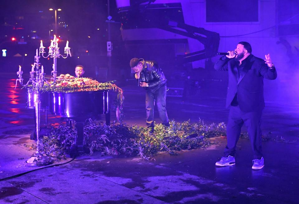 John Legend, Fridayy and DJ Khaled perform onstage at the Grammys.