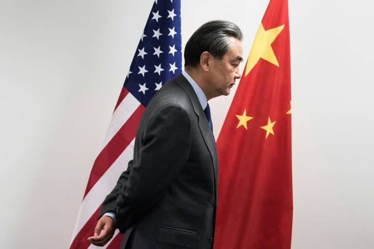 China's Foreign Minister Wang Yi waits for US Secretary of State Rex Tillerson before a meeting on the sidelines of the G20 in Bonn, western Germany, February 17, 2017