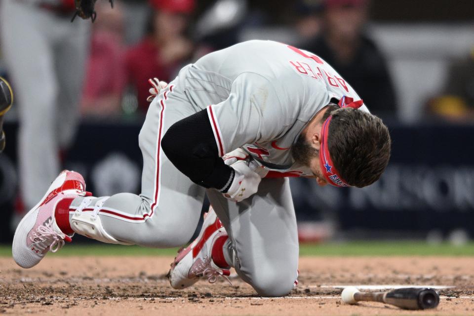 Jun 25, 2022; San Diego, California, USA; Philadelphia Phillies designated hitter Bryce Harper (3) reacts after being hit by a pitch during the fourth inning against the San Diego Padres at Petco Park. Mandatory Credit: Orlando Ramirez-USA TODAY Sports