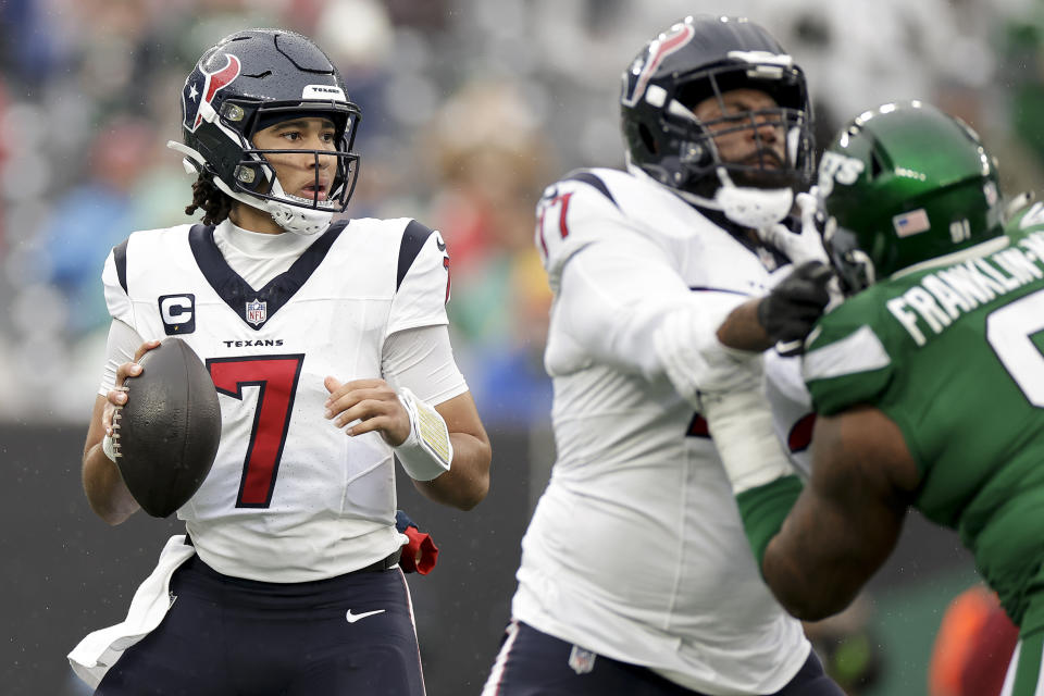 Houston Texans quarterback C.J. Stroud (7) steps back to pass against the New York Jets during the first quarter of an NFL football game, Sunday, Dec. 10, 2023, in East Rutherford, N.J. (AP Photo/Adam Hunger)