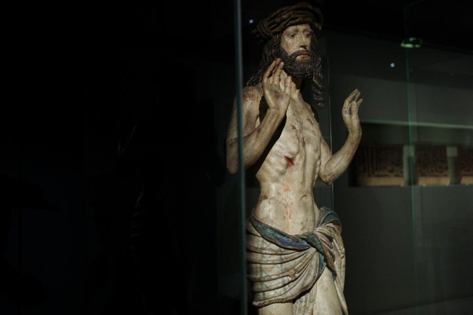 A wooden statue named "Christ showing his wounds" (1520) is displayed as part of the exhibition "Louvre Abu Dhabi. Birth of a museum", at the Louvre museum, in Paris, Monday, April 28, 2014. The Louvre Abu Dhabi, the Persian Gulf’s first ever world museum, will open its doors in December 2015 in the arid Arab federation. Several thousand kilometers away on Tuesday the Louvre in Paris previewed the art that the Abu Dhabi project has acquired since 2009 for the first time to a European audience. (AP Photo/Thibault Camus)