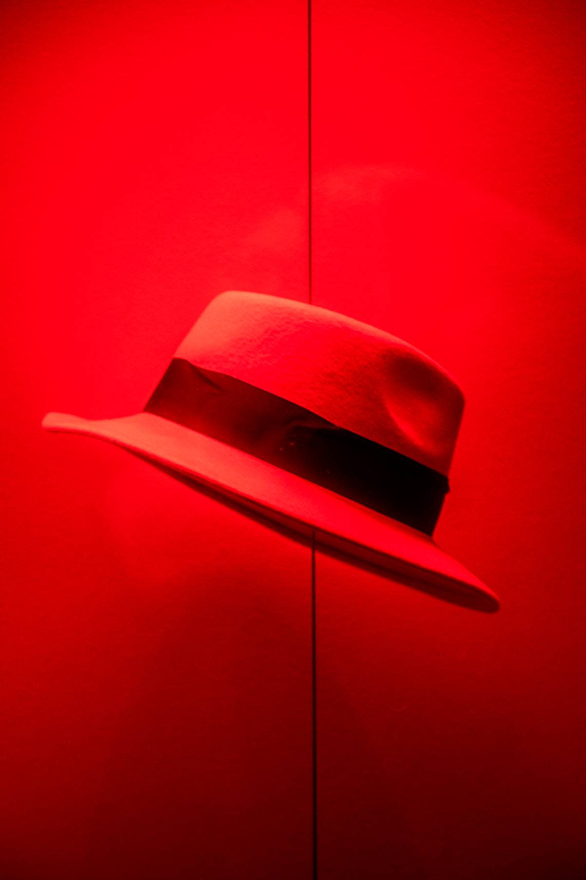 One of many red fedoras on display inside Red Hat’s office building in Raleigh.