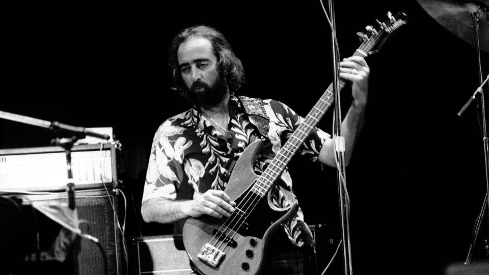 John McVie playing guitar; fleetwood mac members