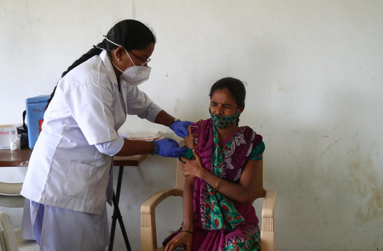 A health worker administers a Covid-19 vaccine dose during a special vaccination drive in Hyderabad, India, on 17 June, 2021  (AP)