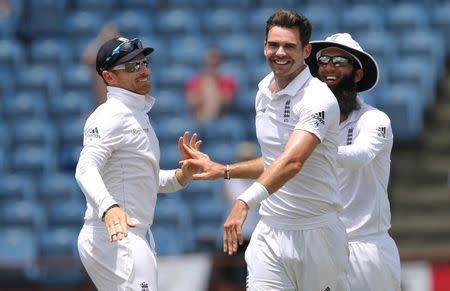 West Indies v England - Second Test - National Cricket Ground, Grenada - 25/4/15 England's James Anderson celebrates the wicket of Jason Holder with Ian Bell and Moeen Ali Action Images via Reuters / Jason O'Brien