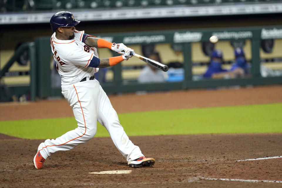 Houston Astros' Martin Maldonado hits a home run against the Texas Rangers during the eighth inning of a baseball game Tuesday, Sept. 15, 2020, in Houston. (AP Photo/David J. Phillip)