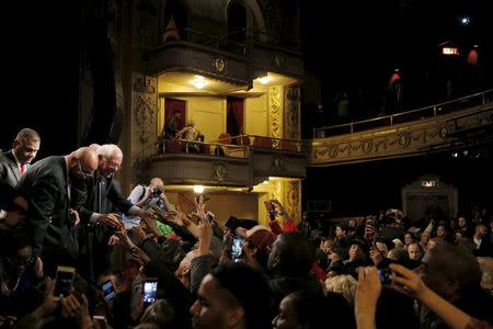 U.S. Democratic presidential candidate and U.S. Senator Bernie Sanders greets audience members at a campaign "Community Conversation" at the Apollo Theater in Harlem, New York April 9, 2016. REUTERS/Brian Snyder