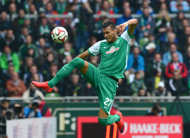 Bremen's Davie Selke goes for a high ball during the Bundesliga match against Borussia Moenchengladbach in Bremen on May 16, 2015