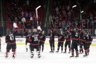 The Carolina Hurricanes salute the fans, who returned to PNC Arena for the first time this season, after a win over the Detroit Red Wings in an NHL hockey game in Raleigh, N.C., Thursday, March 4, 2021. AP Photo/Chris Seward)