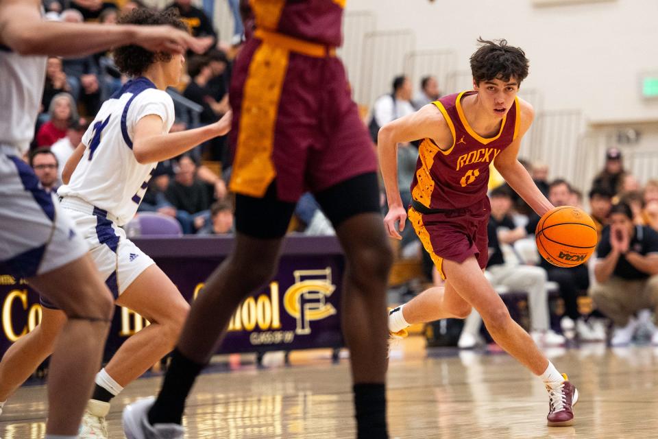 Rocky Mountain's Peyton Matkin brings the ball up court during a game against Fort Collins High School in Fort Collins, Colo., on Thursday, Feb. 15, 2024.