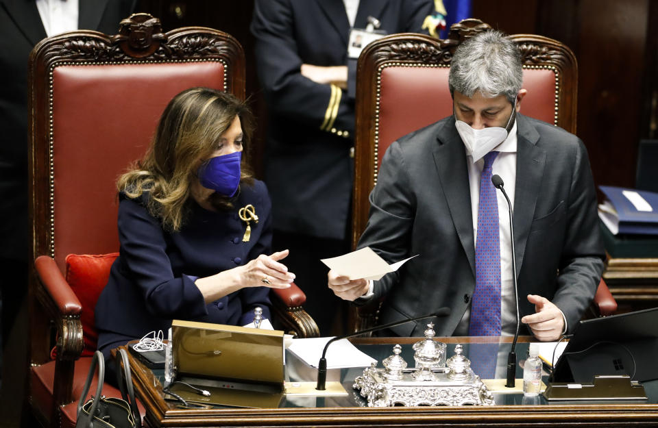 President of the Italian Senate Maria Elisabetta Alberti Casellati, left, and President of the Italian Chamber of Deputies Roberto Fico count ballots during a voting session in the Italian parliament, in Rome, Thursday, Jan. 27, 2022. The first rounds of voting in Italy's Parliament for the country's next president yielded an avalanche of blank ballots, as lawmakers and special regional electors failed to deliver a winner amid a political stalemate. (Remo Casilli/Pool photo via AP)