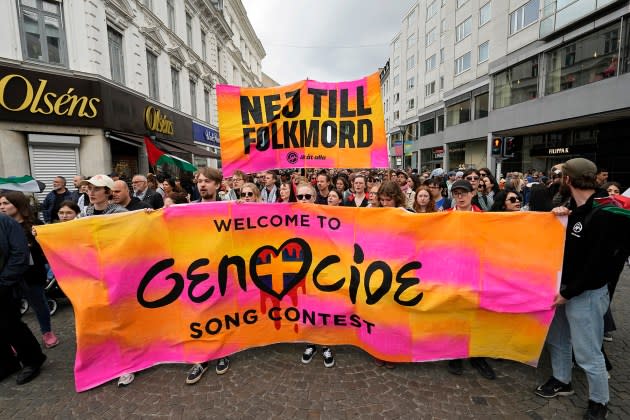 Protesters hold up a banner with the words in Swedish "No to Genocide" during a Pro-Palestinian demonstration ahead of the second semi-final at the Eurovision Song Contest in Malmo, Sweden. - Credit: Martin Meissner/AP