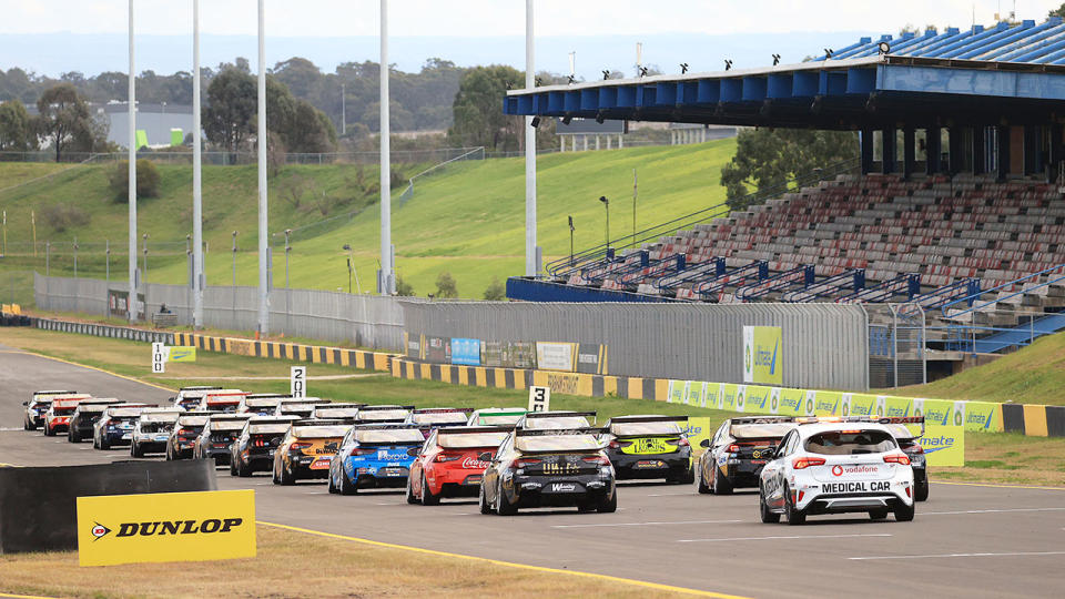 Seen here, a wide shot of Supercars competing at Sydney Motorsport Park.