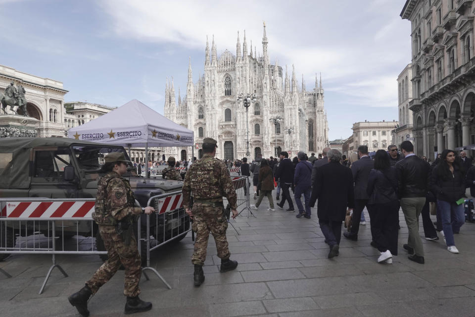 Soldiers patrol in front of Milan gothic cathedral in Milan, Monday, March 25, 2024. Italy followed France Monday in stepping up its security stance following the attack on a suburban Moscow concert hall and the claim of responsibility by an affiliate of the Islamic State group. (AP Photo/Luca Bruno)