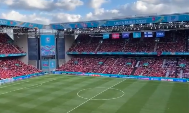 Denmark and Finland fans waiting for Euro match to restart after Christian Erikson collapse.