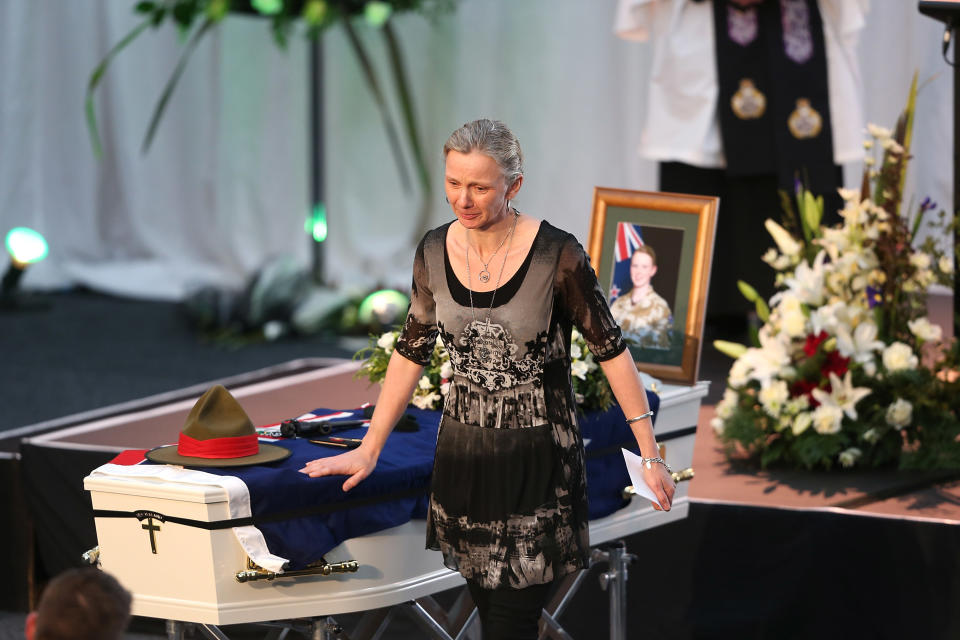 CHRISTCHURCH, NEW ZEALAND - AUGUST 25: Lance Corporal Jacinda Baker's mother pays her respect during a combined memorial service for fallen soldiers Corporal Luke Tamatea, Lance Corporal Jacinda Baker and Private Richard Harris at Burnham Military Camp on August 25, 2012 in Christchurch, New Zealand. The three fallen New Zealand soldiers were fatally wounded in action on August 4, 2012, in the Bayman Province in Afghanistan. (Photo by Martin Hunter/Getty Images)