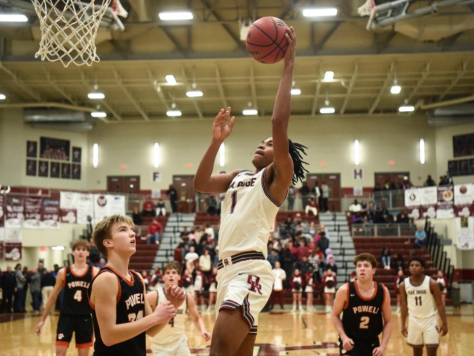 Oak Ridge's Darren Osborne (1) goes to the basket over Powell's Bryce Jardret (24) in the boys high school basketball game between the Oak Ridge Wildcats and Powell Panthers in Oak Ridge, Tenn. on Friday, January 21, 2022.