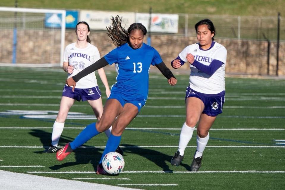 Anna Barnette dribbles up the sideline in the team's March 11 win against Mitchell.