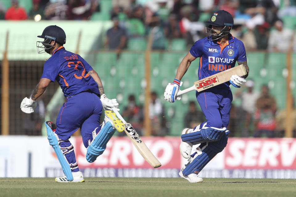 India's Virat Kohli, right, and Ishan Kishan, left, run between the wickets during the third one day international cricket match between Bangladesh and India in Chittagong, Bangladesh, Saturday, Dec. 10, 2022. (AP Photo/Surjeet Yadav)