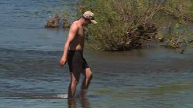 A man walks in the Sandy River in Corbett, May 11, 2024 (KOIN)