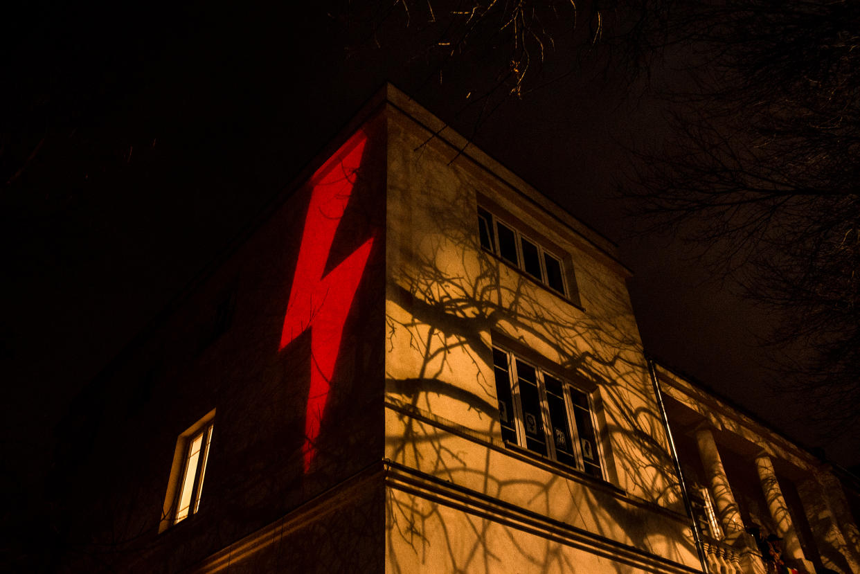 A red lightning bolt, the prominent symbol of recent protests against a Polish court's decision to effectively put a complete ban on abortion, is projected against a building in Warsaw on Oct. 30, 2020.