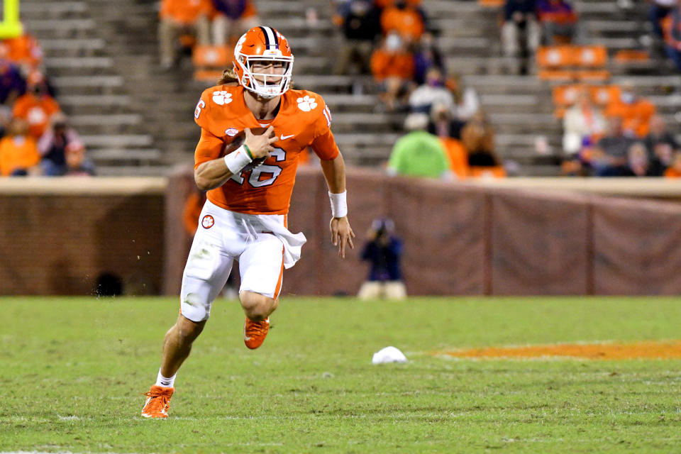 CLEMSON, SC - OCTOBER 03: Clemson Tigers quarterback Trevor Lawrence (16) scrambles down field on the quarterback keeper during the game between the Clemson Tigers and the Virginia Cavaliers on October 03, 2020 at Memorial Stadium in Clemson, South Carolina. (Photo by Dannie Walls/Icon Sportswire via Getty Images)