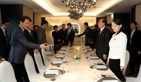 Im Jong-seok, the Chief Presidential Secretary for President of South Korea Moon Jae-in, leads Kim Yo Jong, the sister of North Korea's leader Kim Jong Un, during a banquet at a hotel in Seoul, South Korea, February 11, 2018. The Presidential Blue House/Yonhap via REUTERS