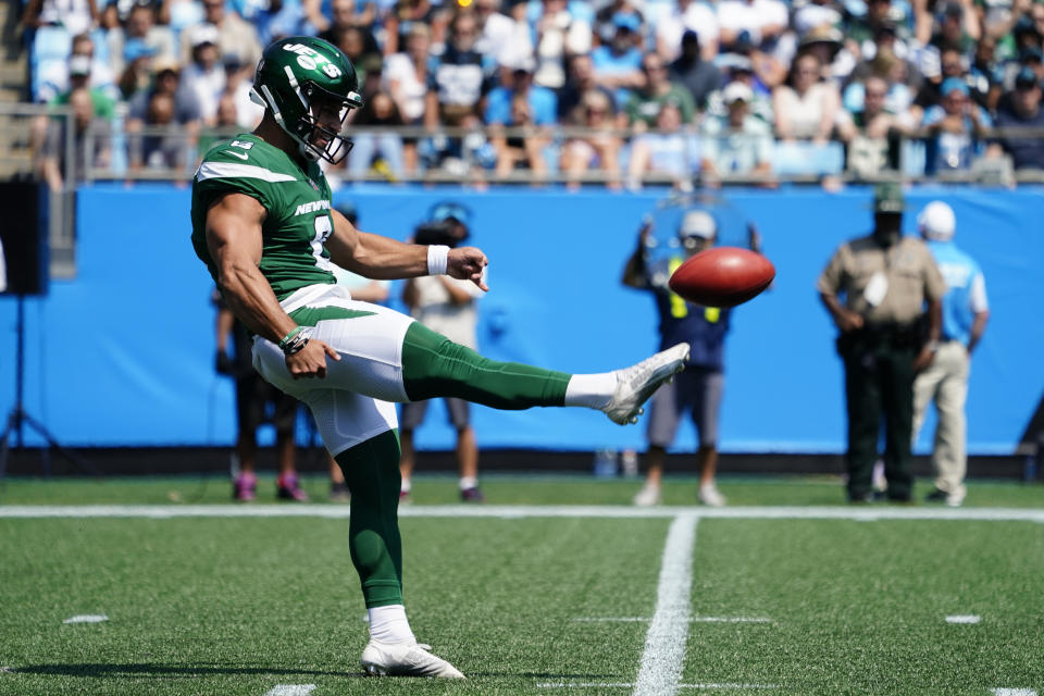 New York Jets kicker Matt Ammendola punts against the Carolina Panthers during the first half of an NFL football game Sunday, Sept. 12, 2021, in Charlotte, N.C. Punter Braden Mann sprained his left knee during his first punt and the Jets had to turn to Ammendola to handle the punting duties. (AP Photo/Jacob Kupferman)