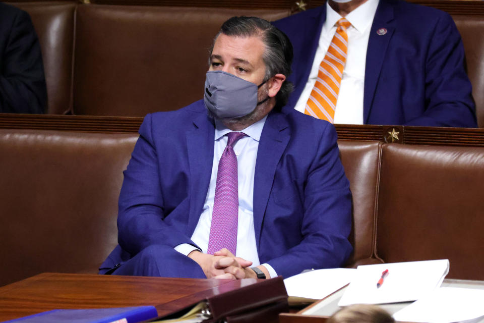 WASHINGTON, DC - JANUARY 06: Sen. Ted Cruz (R-TX) stands in the House Chamber during a reconvening of a joint session of Congress on January 06, 2021 in Washington, DC. Members of Congress returned to the House Chamber after being evacuated when protesters stormed the Capitol and disrupted a joint session to ratify President-elect Joe Biden's 306-232 Electoral College win over President Donald Trump. (Photo by Win McNamee/Getty Images)