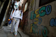 Manoel Pereira Costa, known as "Master Manel", walks in the Rocinha favela in Rio de Janeiro, Brazil, July 25, 2016. REUTERS/Bruno Kelly