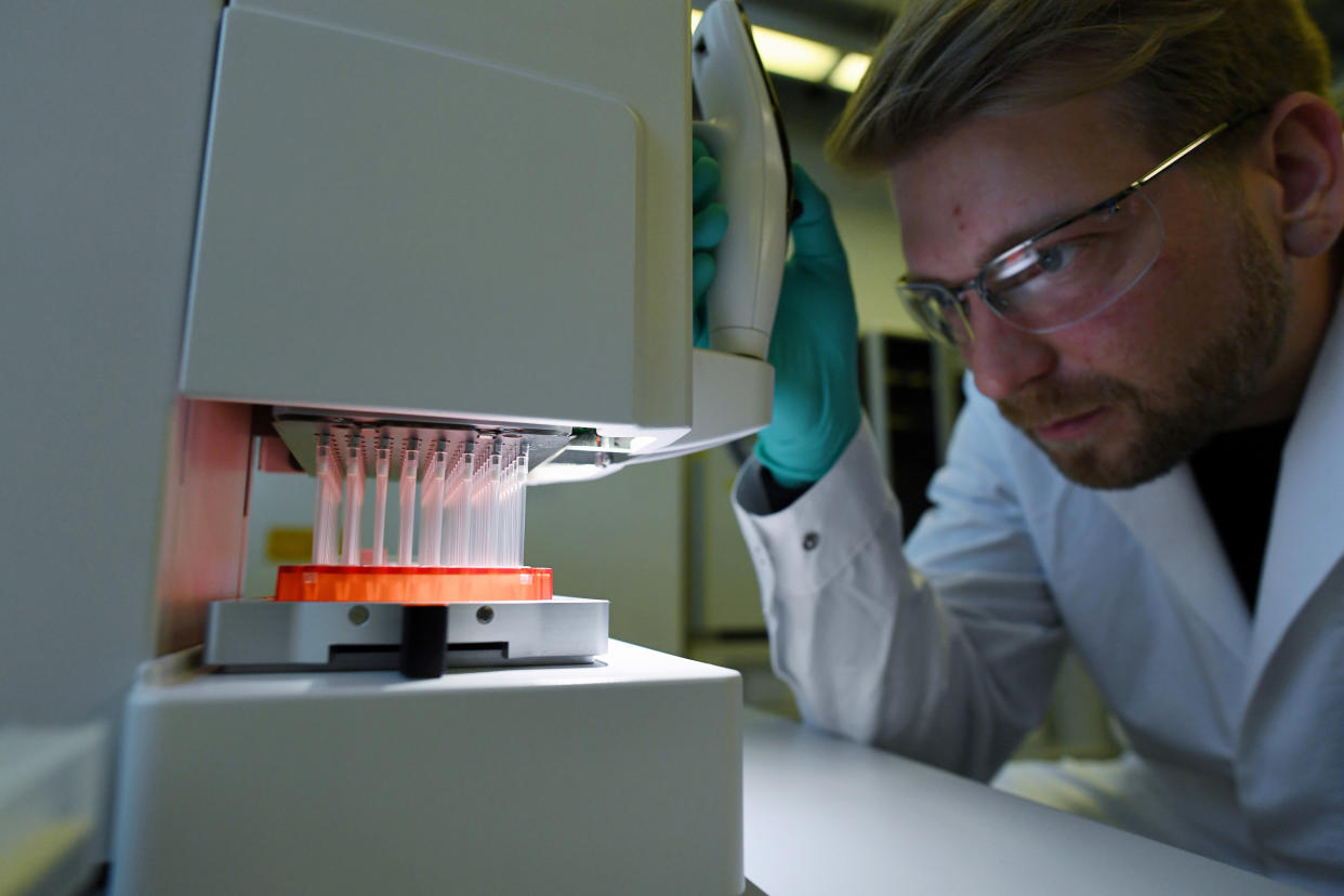 Employee Philipp Hoffmann, of German biopharmaceutical company CureVac, demonstrates research workflow on a vaccine for the coronavirus (COVID-19) disease at a laboratory in Tuebingen, Germany on March 12, 2020. (Andreas Gebert/Reuters)