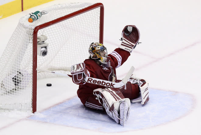 GLENDALE, AZ - MAY 15: Goaltender Mike Smith #41 of the Phoenix Coyotes reacts after the puck goes into the net for a goal on a deflection by Dwight King #74 of the Los Angeles Kings (not in photo) in the first period of Game Two of the Western Conference Final during the 2012 NHL Stanley Cup Playoffs at Jobing.com Arena on May 15, 2012 in Phoenix, Arizona. (Photo by Jeff Gross/Getty Images)