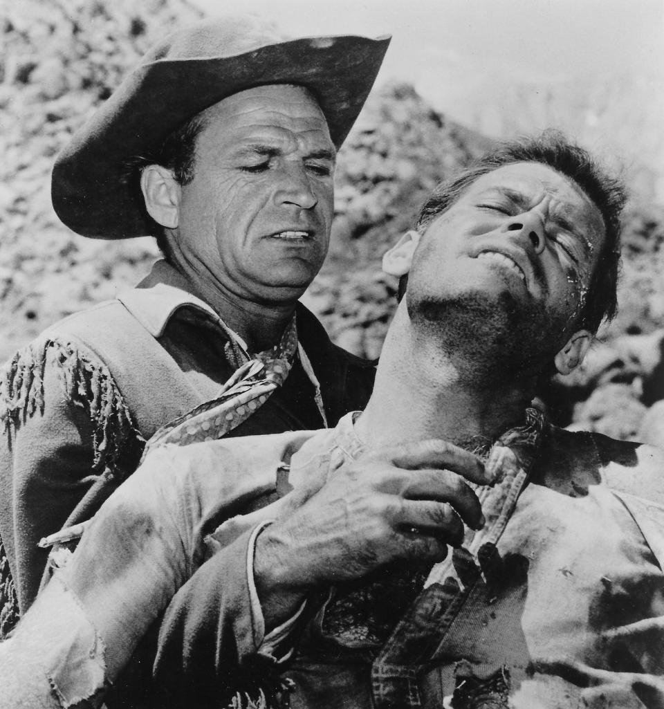 Akron native David McLean, playing Kit Carson, rescues a wounded Charles Bateman in a 1963 episode of the syndicated TV series “Death Valley Days.”