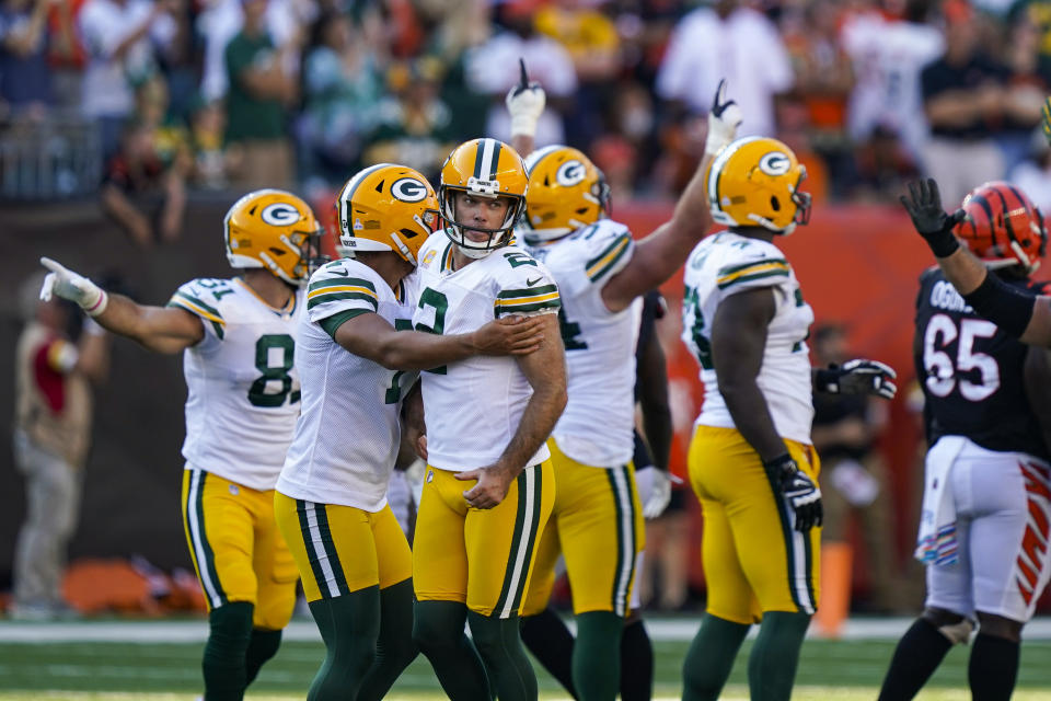 Green Bay Packers kicker Mason Crosby (2) celebrates after a winning field goal during overtime in an NFL football game against the Cincinnati Bengals in Cincinnati, Sunday, Oct. 10, 2021. The Packers defeated the Bengals 25-22 in overtime. (AP Photo/Bryan Woolston)