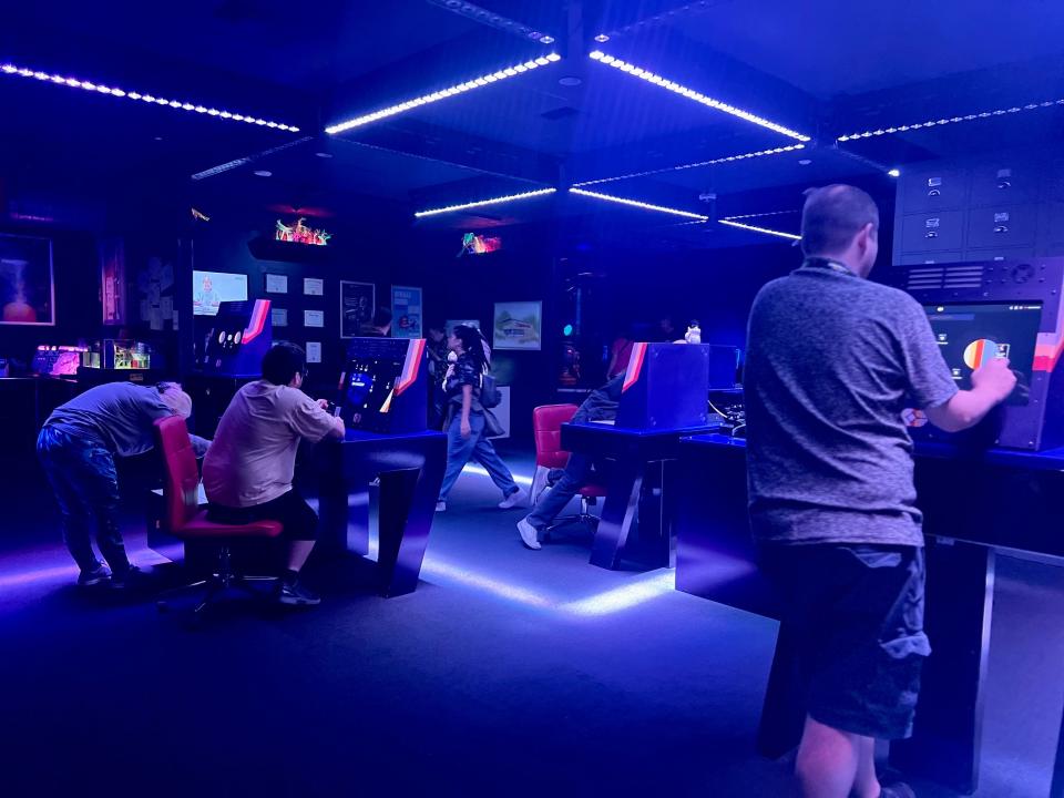 People working on computers to solve the mystery in the blue-lit office.