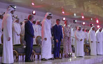 IOC president Thomas Bach, Emir of Qatar Sheikh Tamim bin Hamad Al Thani and IAAF President Sebastian Coe during the opening ceremony for the World Athletics Championships on the Corniche in Doha, Qatar, Friday, Sept. 27, 2019. (AP Photo/Hassan Ammar)