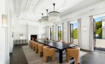 <p>In the main dining room, French doors that open up to the outside bring in a sense of warmth.</p>