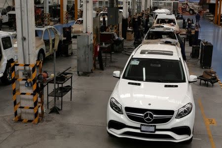 A general view shows armored vehicles at the garage of Blindajes EPEL company in Mexico City, Mexico April 9, 2018. Picture taken April 9, 2018. REUTERS/Gustavo Graf