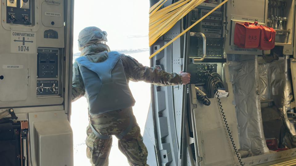 Staff Sgt. Derek Dion, a jumpmaster with 3rd Battalion, 509th Parachute Infantry Regiment, 2nd Infantry Brigade Combat Team (Airborne), performs a door inspection during an airborne operation over Donnelly Training Area, Alaska, Feb. 8, 2024.