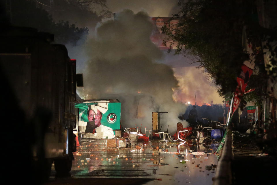 Police fired teargas to disperse the supporters of the former Prime Minister as they tried to arrest Khan in Lahore, Pakistan, on March 14. Hundreds of Tehrik-e-Insaf supporters clashed with riot police as they reached Khan's residence.<span class="copyright">Rahat Dar—EPA-EFE/Shutterstock</span>