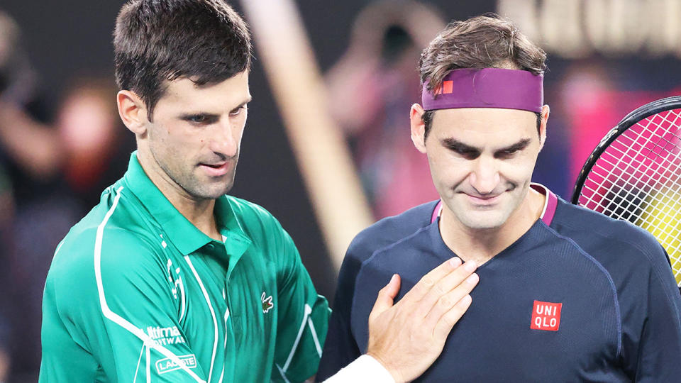 Former world No.1 Boris Becker says Roger Federer, right, has the edge over Novak Djokovic as the best player of all time. (Photo by DAVID GRAY/AFP via Getty Images)