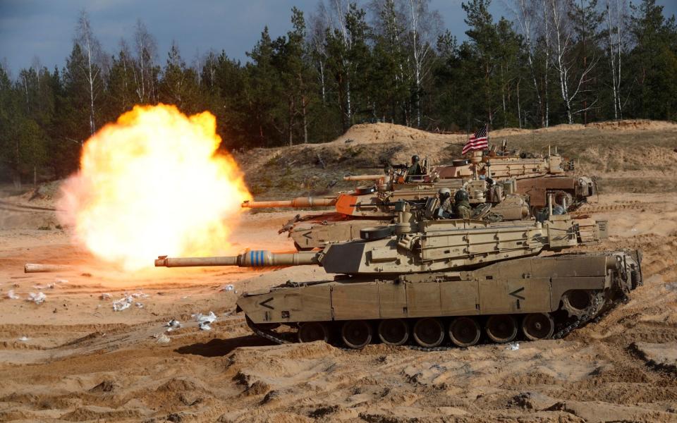 US Abrams tank in action during a NATO exercise in Latvia - INTS KALNINS/REUTERS