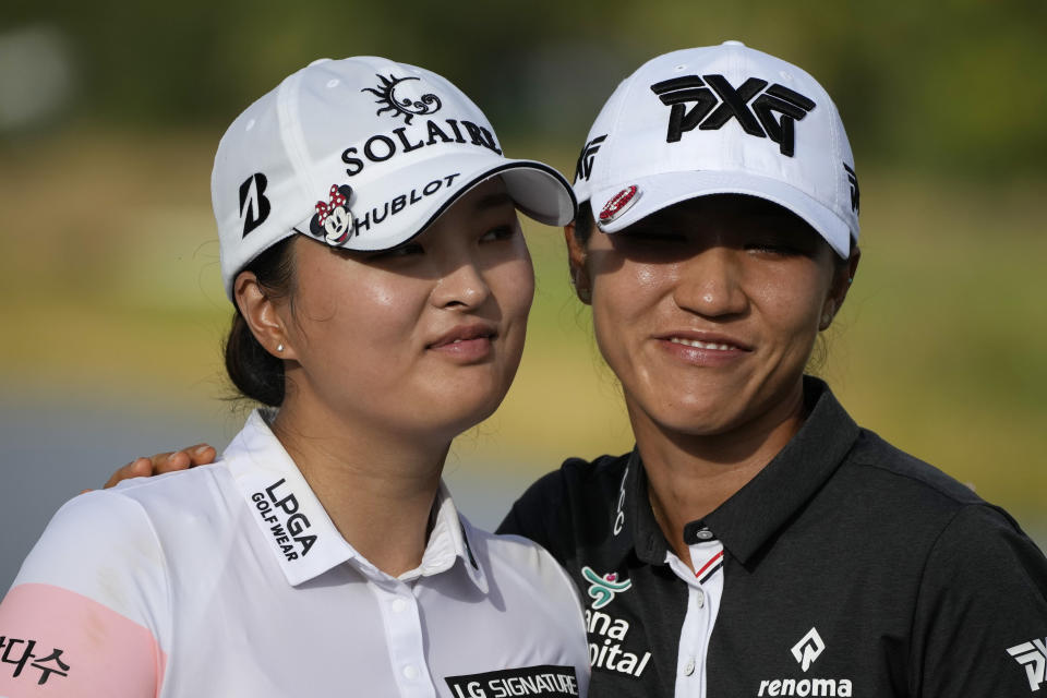 Jin Young Ko, of Korea, left, and Lydia Ko, of New Zeland, pose during the awards ceremony after the LPGA Tour Championship golf tournament, Sunday, Nov. 21, 2021, in Naples, Fla. (AP Photo/Rebecca Blackwell)