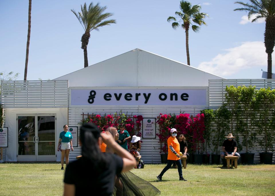 Festival goers sit in front of the "Every One" safe-space at the Coachella Valley Music and Arts Festival in Indio, Calif. on Fri. April 12, 2019. 