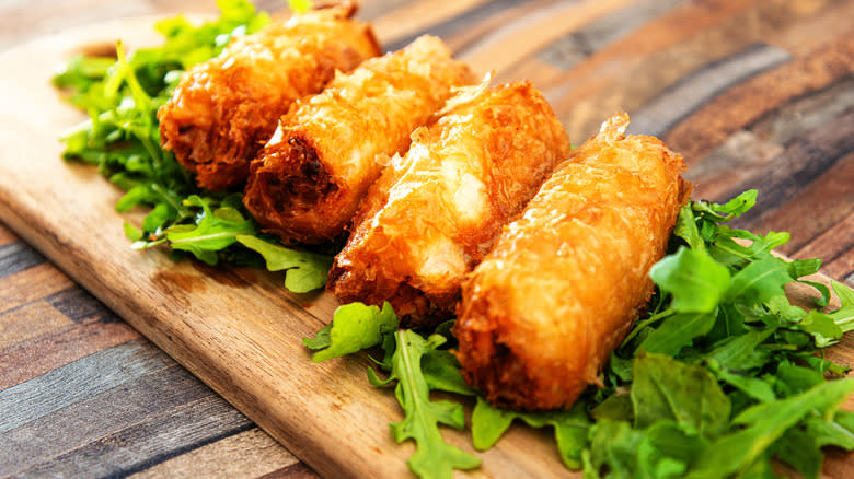 pork spring rolls on a cutting board