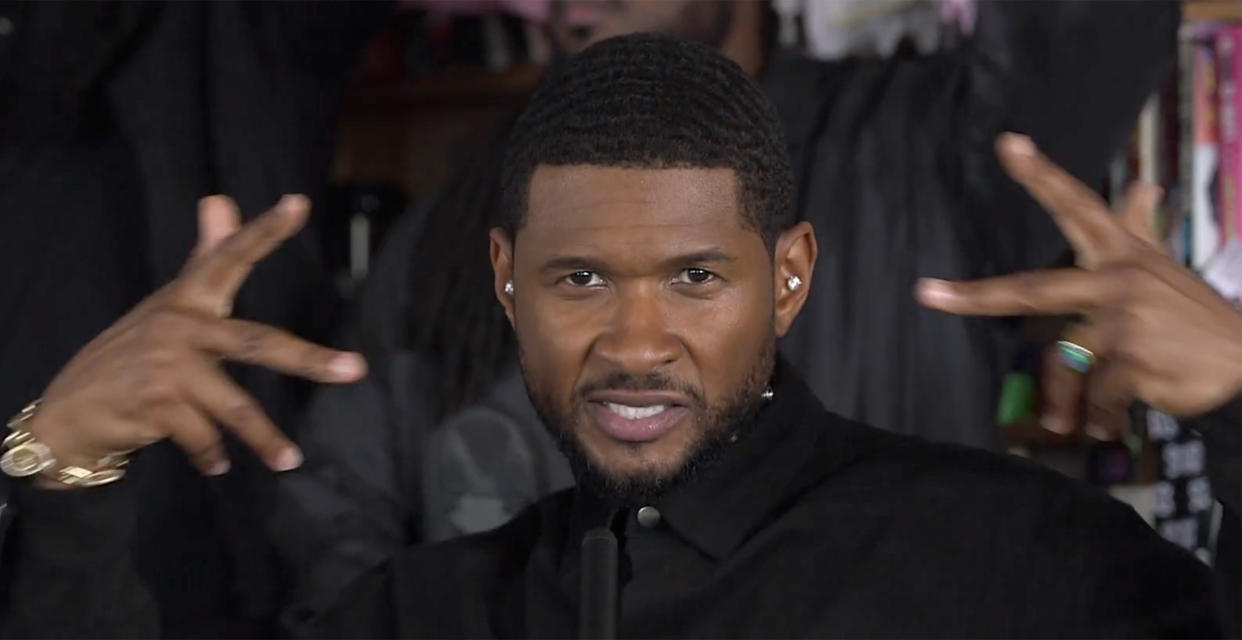 Usher did this hand gesture in front of his face and widened it out to the sides of his face before performing his hit song, 